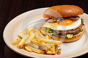 Burger with egg and fries