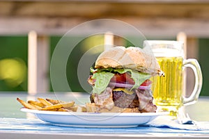 Burger, fries and beer on the deck