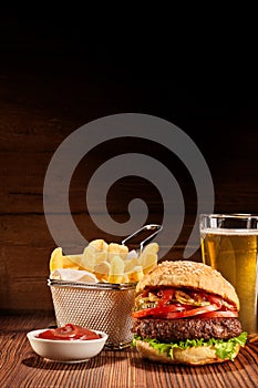 Burger with fries and pint of lager