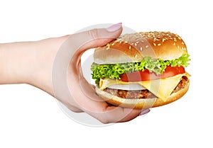 Burger in hand isolated on white background