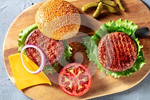 Burger. Homemade hamburger ingredients, American food. Delicious beef steaks etc