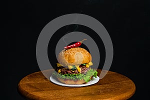 Burger with hot chili pepper and smoke