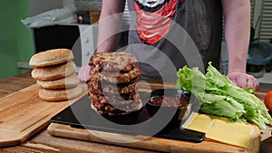 Burger ingredients on cutting board