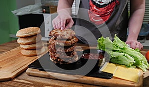 Burger ingredients on cutting board