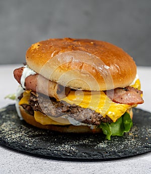 Burger with meat cutlet, hamburger isolated on grey background. Tasty Hamburger. Restaurant dish.