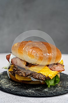 Burger with meat cutlet, hamburger isolated on grey background. Tasty Hamburger. Restaurant dish.