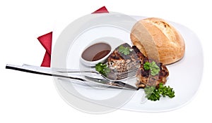 Burger on a plate isolated on white