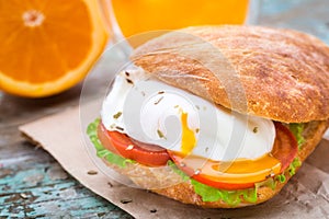 Burger with pouched egg and tomato