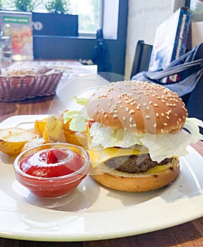 Burger with salad and tomato sauce