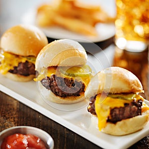 Burger sliders with melted cheese and pickle