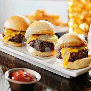 Burger sliders with melted cheese and pickle