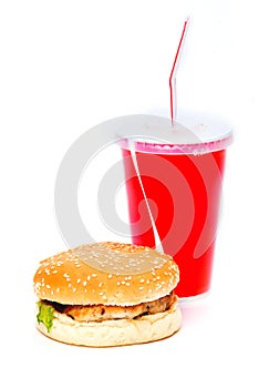 Burger and soda drink with red straw on white background