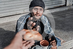 Burger from stranger. Smiling broadly homeless elderly man feeling cheerful while eating burger from stranger