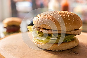 Burger on a wood board.