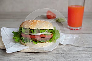 Burger on a  with tomatto juice