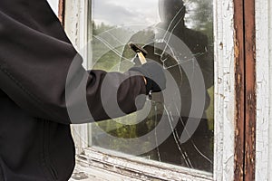 Burglar entering to house trough window