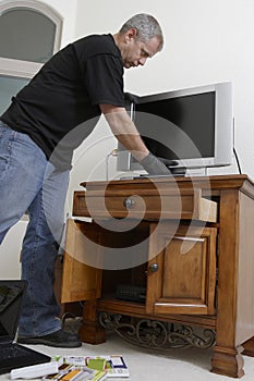Burglar Stealing Television