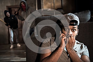 Burglars and scared man