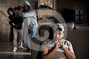 Burglars and scared man