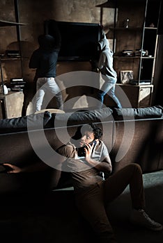 Burglars and scared man