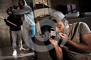 Burglars and scared man