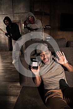 Burglars and scared man