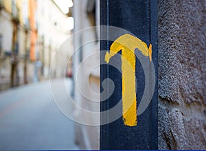 Burgos city Way of Saint James yellow arrow sign