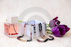 Burgundy color tulips, female beads in a white gift box, Eau de Toilette