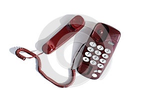 Burgundy landline phone stands on a white background