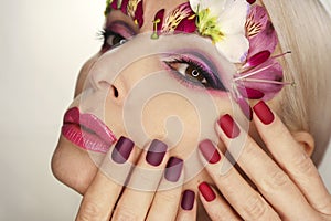 Burgundy red manicure and eye makeup