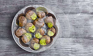 Burgundy snail on a plate