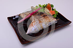 Buri-Kama Shioyaki ,Broiled Yellowtail Collar Shio-Yaki , Traditional Japanese food isolated on white background