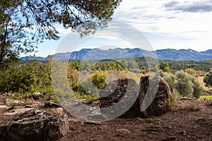 Burial mound made of stones in the countryside, Mas de Toribio near Calaceite, Teruel, Aragon, Spain photo