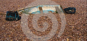 Buried rowing boat on Sidmouth beach