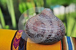 Burilados mates are fruits of mate or gourd decorated by hand with a technique called burilado