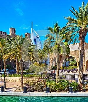 Burj al Arab behind the palm trees, Souk Madinat Jumeirah, Dubai, UAE