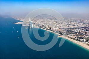 Burj Al Arab hotel in Dubai UAE aerial view at sunset