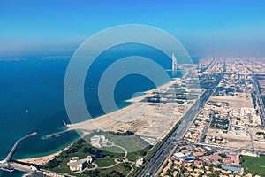 Burj Al Arab hotel in Dubai UAE aerial view at sunset