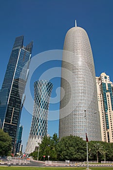 Burj Doha (Burj Qatar, Doha Tower), QIPCO Tower and Palm Tower against clear blue sky, close up view