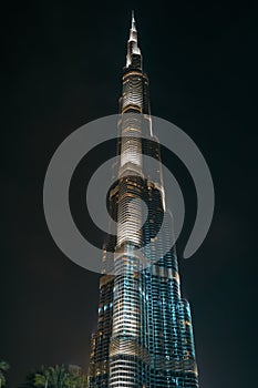 Burj Khalifa in Dubai downtown at night - highest tower building in world, famous UAE landmark