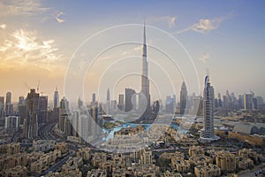 Burj Khalifa and Dubai Fountain against the sunset