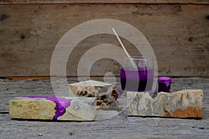 burl woodchips color bottle and resin epoxy for casting wood on old wooden table background