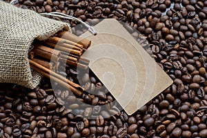 Burlap bag with cinnamon and coffee raw beans and sale label