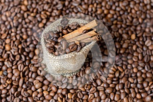 Burlap bag with cinnamon and coffee raw beans and smoke