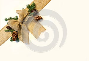 Burlap Christmas Bow and Pine Cones Frame on White Background