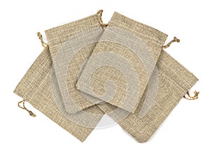 Burlap gift bags on isolated white background