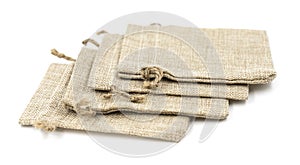 Burlap gift bags on isolated white background