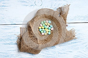 Burlap nest with colorful easter eggs