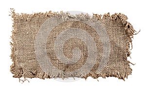 Burlap texture. A piece of torn burlap on a white background. Canvas. Packing material