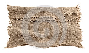 Burlap texture. A piece of torn burlap on a white background. Canvas. Packing material